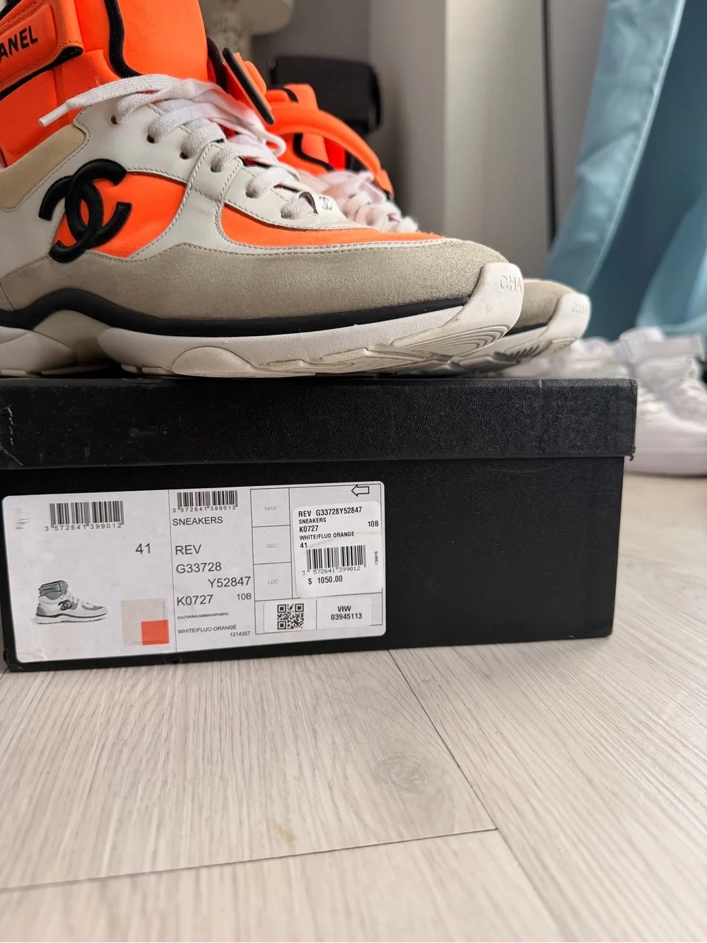 CHANEL Orange and Black High-Top Sneaker